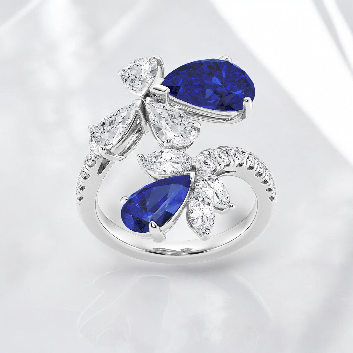 11.48x7.06 mm and 8.5x5.6 mm Pear Shaped Created Sapphire with Mixed Lab Grown Diamond Bypass Fashion Ring