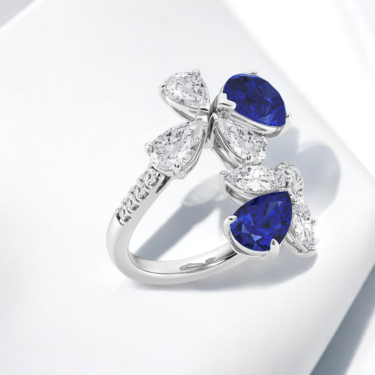 11.48x7.06 mm and 8.5x5.6 mm Pear Shaped Created Sapphire with Mixed Lab Grown Diamond Bypass Fashion Ring